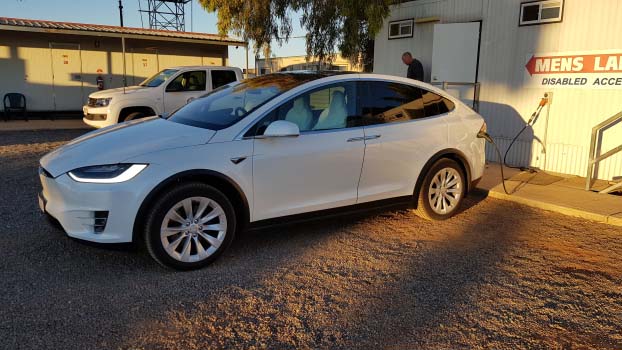 Electric vehicle plugged in at Devils Marbles