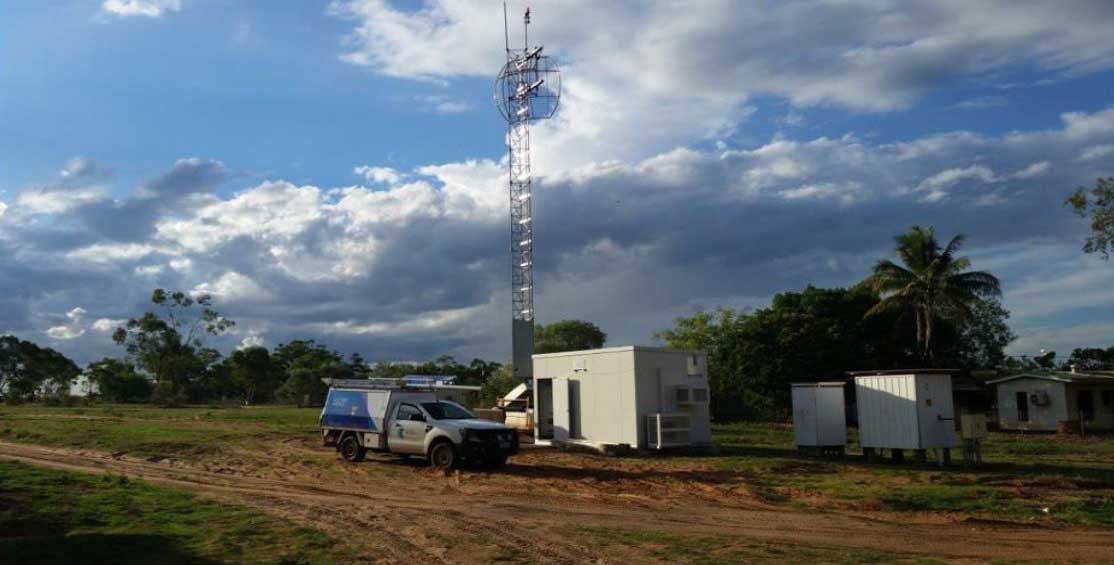 Telstra vehicle in front of a mobile tower in remote NT