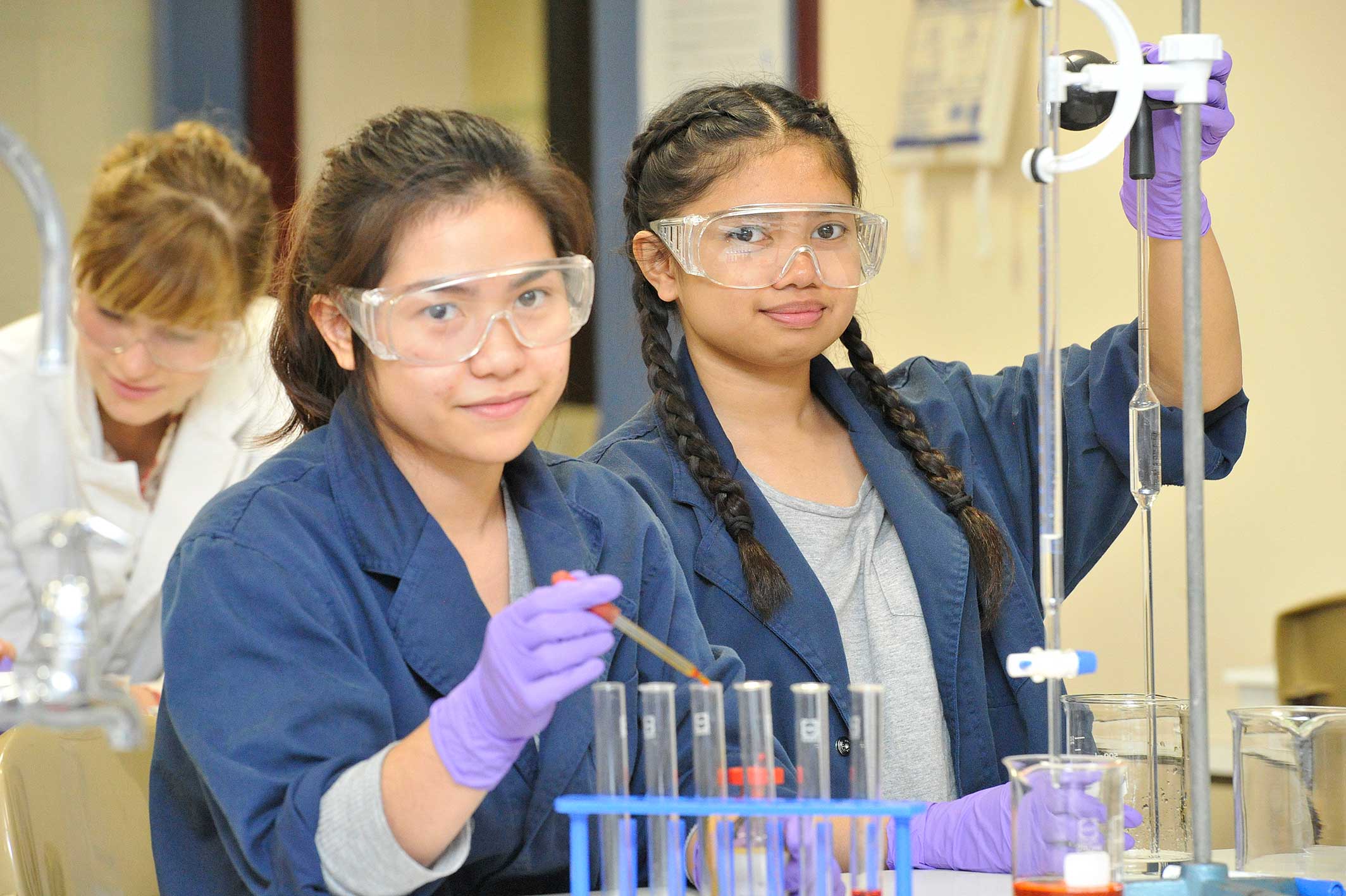 Two female students in a science lab