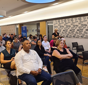 Group of people sitting at a conference